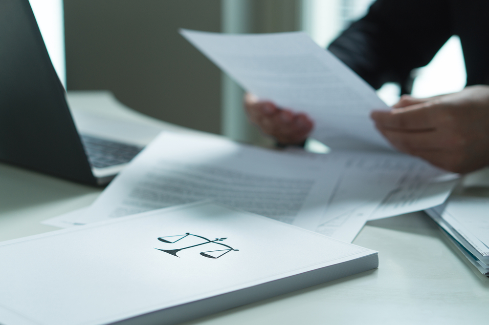 Man holding legal documents